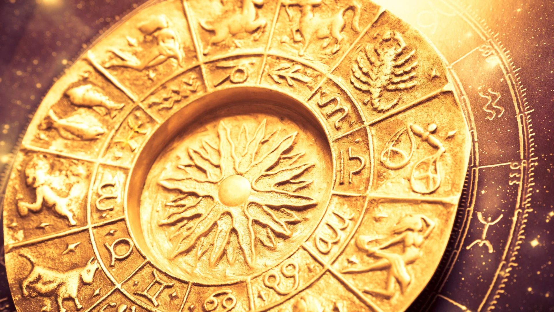 Roata zodiacului cu cele 12 semne astrologice pe un fundal de cer înstelat